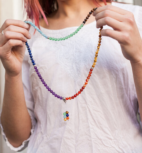 Holding the 108 Bead Chakra Mala