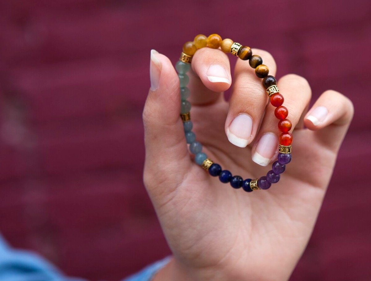 Meditating with the 7 Stone Chakra Bracelet - Golden Om Edition