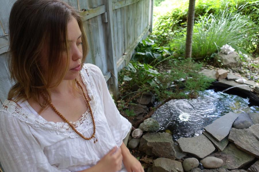 Meditating with Traditional Wooden Mala